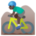 🚵🏿‍♂️ man mountain biking: dark skin tone display on Google